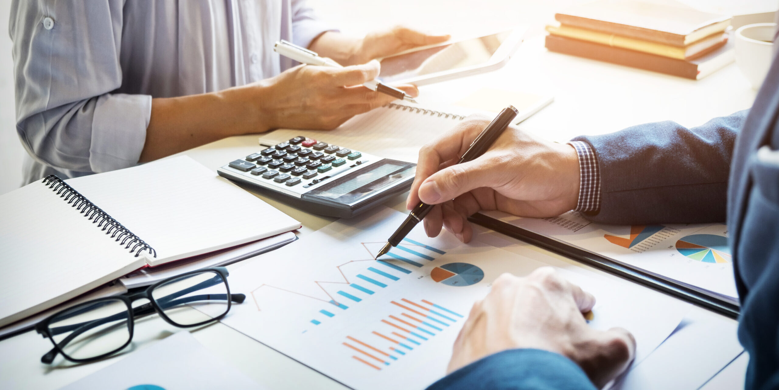 business man financial inspector and secretary making report, calculating or checking balance. Internal Revenue Service inspector checking document. Audit concept